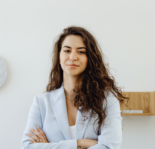 Stock photo of a woman standing with arms folded