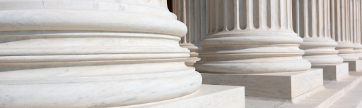 Close-up stock photo of pillars on a government building.