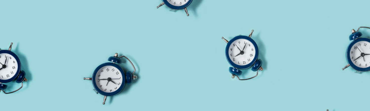 Small clocks on light blue background.