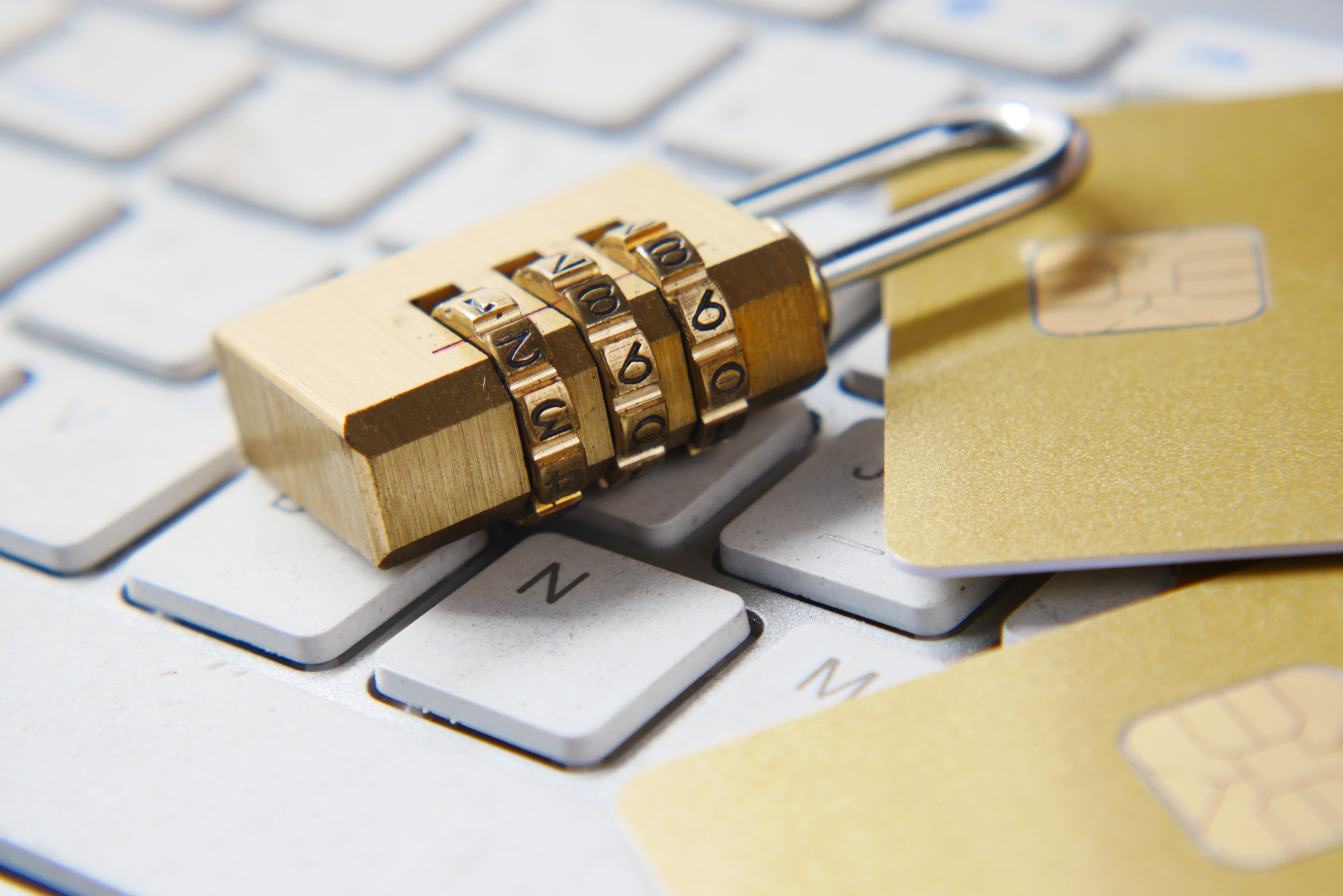 Image of a golden padlock sitting on top of a keyboard.