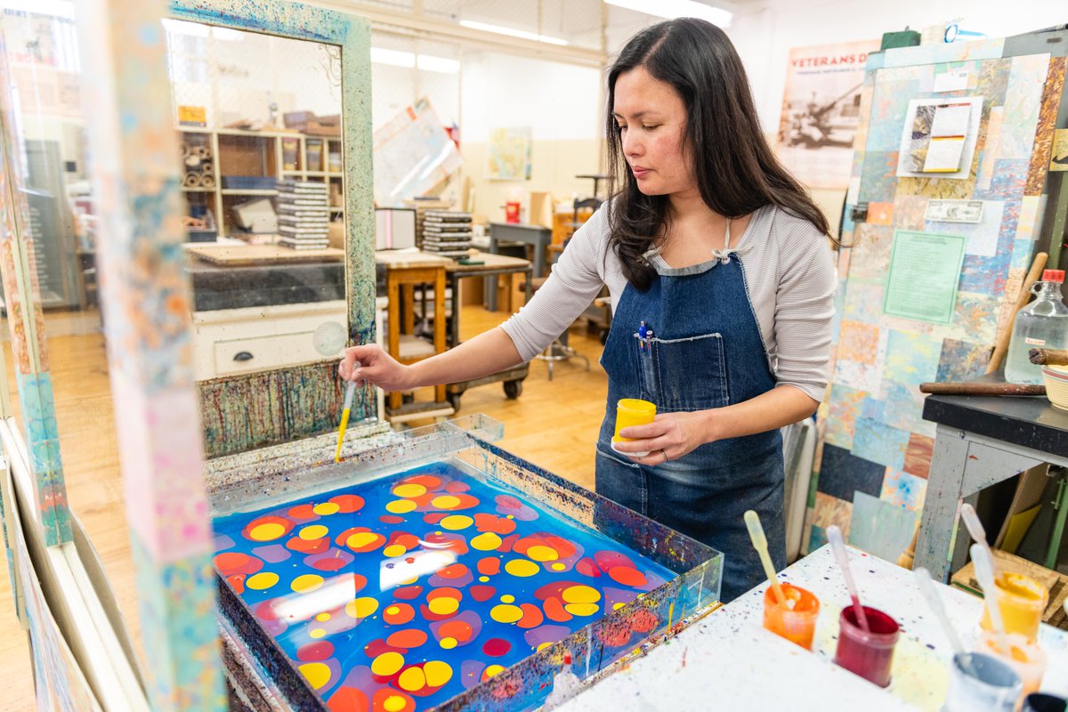 Sarah Hurtt adding color to a book marbling solution