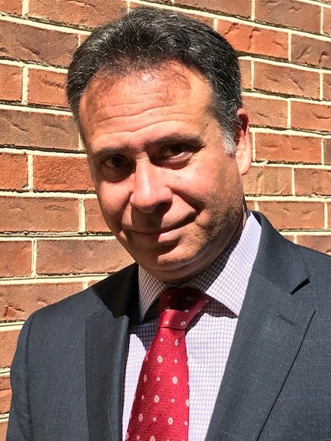 Headshot of John Tuminaro, former WHLDP Fellow