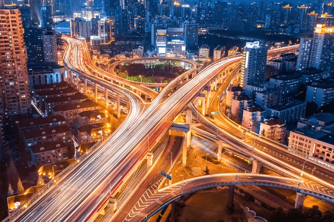 Picture of highway interchanges at night.