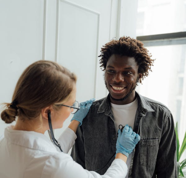 Image of doctor and patient hugging.